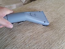 Using our sheardry hand tool to clean the arm of a sofa